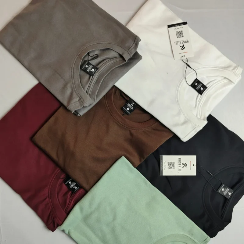 multiple tshirts are spread on top of eachother